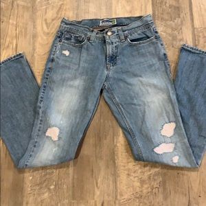 Women’s denim jeans with pink distressed few spot